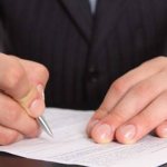 Man signing a document
